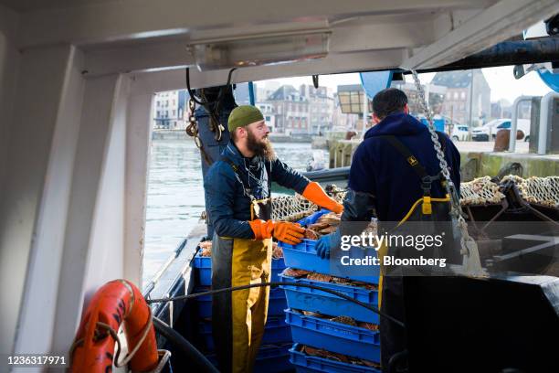 Fisherman prepare to unload a catch of fresh scallops aboard a French trawler at the Port of Dieppe, France, on Wednesday, Nov. 3, 2021. U.K. Prime...