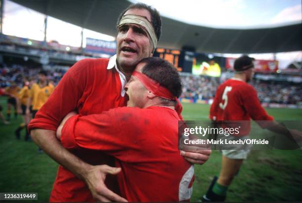 July 1989 Sydney, Australia v British Lions - Lions hooker Brian Moore clings to the chest of Paul Ackford at the final whistle.