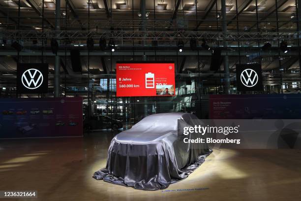 Cloth covers a Volkswagen ID.5 GTX all-electric automobile before its reveal during the world unveiling at the Volkswagen AG auto plant in Dresden,...