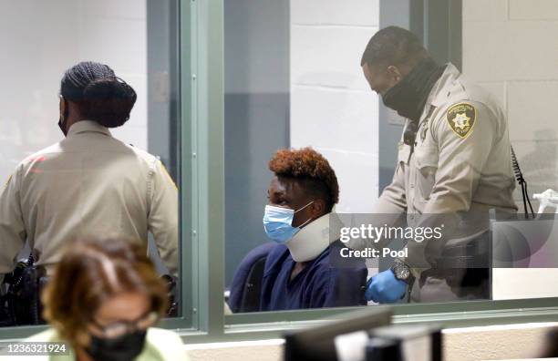 Former Las Vegas Raiders wide receiver Henry Ruggs III is taken out of the courtroom in a wheelchair after making an initial appearance in Las Vegas...