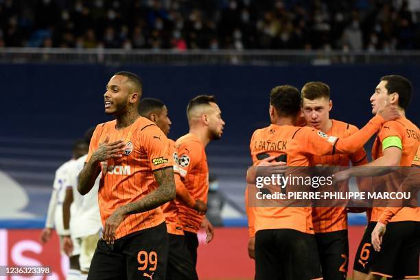 Shakhtar Donetsk's Brazilian forward Fernando Dos Santos Pedro celebrates after scoring his team's first goal during the UEFA Champions League first...