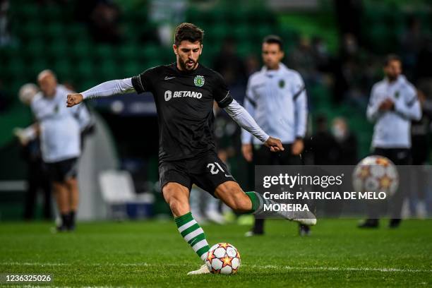 Sporting's Portuguese forward Paulinho Dias Fernandes warms up before the start of the UEFA Champions League first round group C football match...