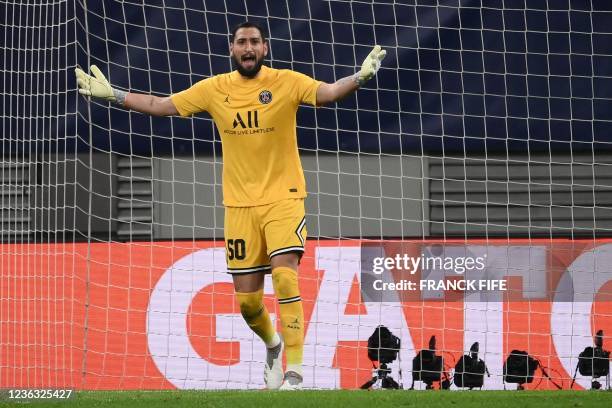 Paris Saint-Germain's Italian goalkeeper Gianluigi Donnarumma celebrates saving a penalty shot during the UEFA Champions League, Group A, football...