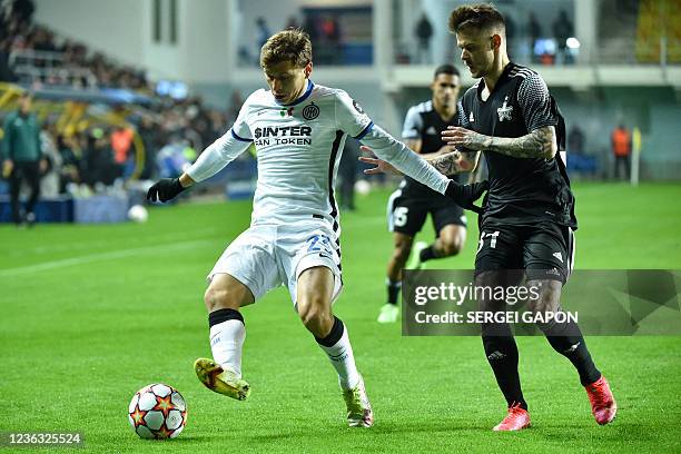 Inter Milan's Italian midfielder Nicolo Barella and Sheriff's Luxembourger midfielder Sebastien Thill vie for the ball during the UEFA Champions...