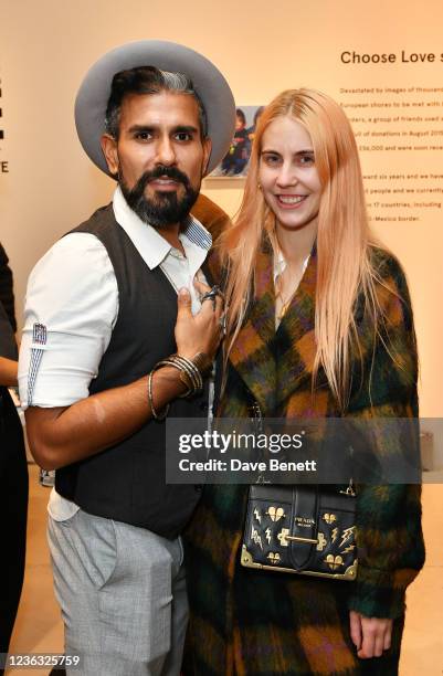 Azim Majid and India Rose James attend the opening of the Choose Love shop for Help Refugees in Carnaby Street on November 3, 2021 in London, England.