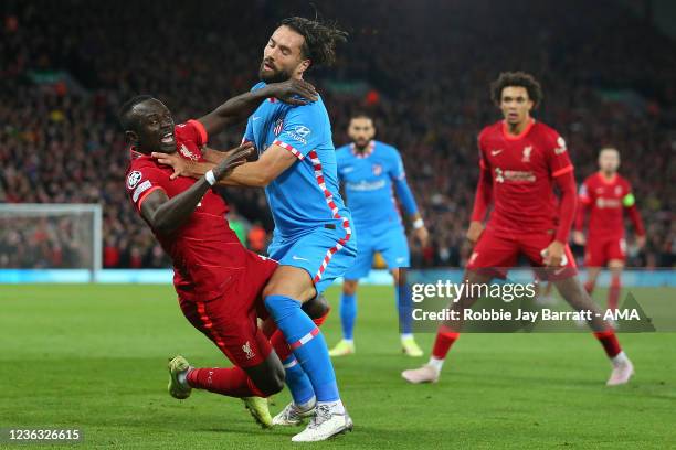 Sadio Mane of Liverpool is barged to the floor by Felipe of Atletico Madrid during the UEFA Champions League group B match between Liverpool FC and...