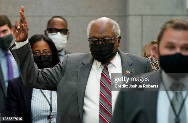 House Majority Whip James Clyburn crosses his fingers as he walks to a Democratic House caucus meeting on Capitol Hill on November 3, 2021 in...