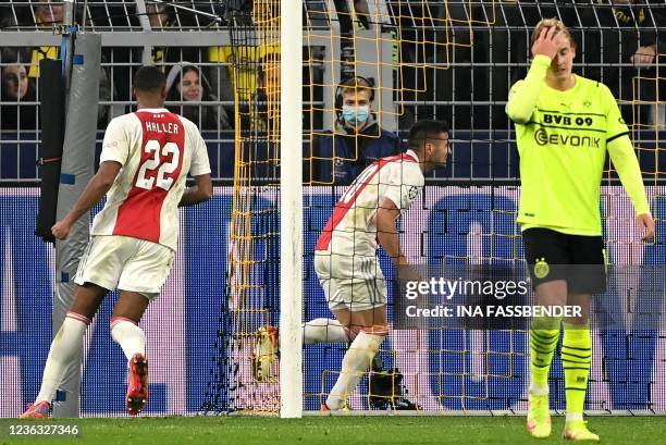 Ajax Amsterdam's Serbian forward Dusan Tadic scores the 1-1 equalising goal during the UEFA Champions League, Group C, football match BVB Borussia...
