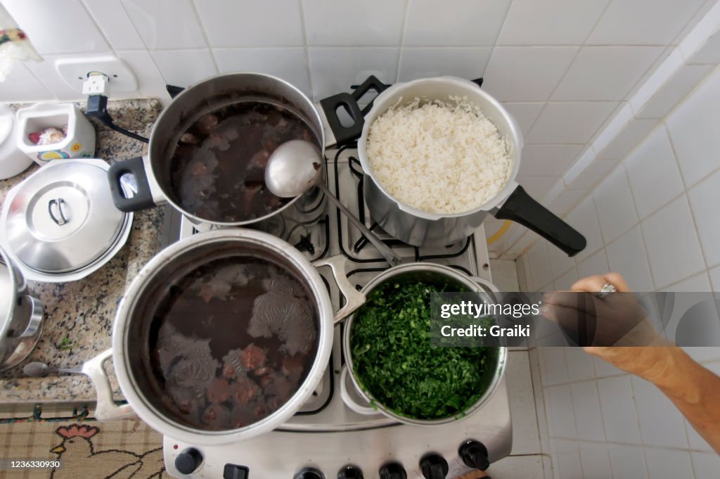 Cooking feijoada on the stove.