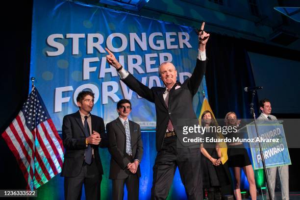 New Jersey Governor Phil Murphy greets supporters as he arrives to give a victory speech at Grand Arcade at the Pavilion on November 3, 2021 in...