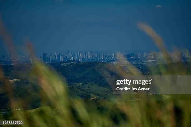 View from one of the peak of Masungi georeserve, of the skyline of the nearby Metro Manila, a sprawling city with rapid population growth on November...