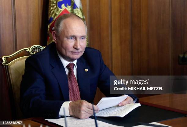Russia's President Vladimir Putin attends a meeting of the Supreme State Council of the Union State of Russia and Belarus on Unity Day, via...