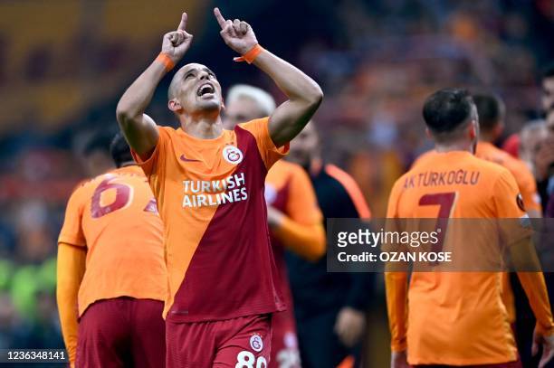 Galatasaray's Algerian midfielder Sofiane Feghouli celebrates with teammates after scoring during the UEFA Europa League group E football match...