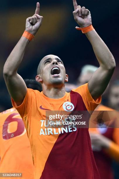 Galatasaray's Algerian midfielder Sofiane Feghouli celebrates after scoring during the UEFA Europa League group E football match between Galatasaray...