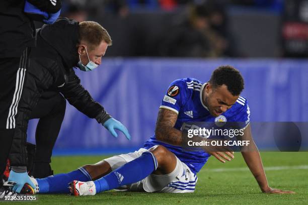 Leicester City's English defender Ryan Bertrand reacts as he's treated for an injury during the UEFA Europa League Group C football match between...