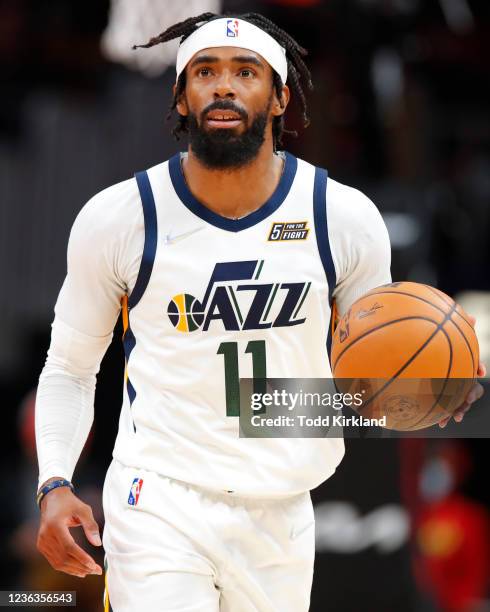 Mike Conley of the Utah Jazz drives down the court during the second half against the Atlanta Hawks at State Farm Arena on November 4, 2021 in...