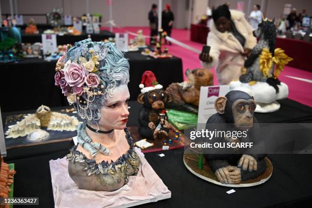 Cakes are displayed in the 'Sculpted Cake' class as judging takes place in the cake competition area on the opening day of Cake International at the...