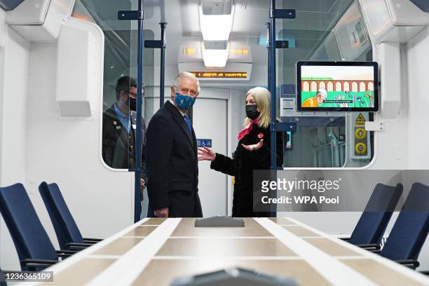 Prince Charles, Prince of Wales inspects a hydrogen powered train as he visits Glasgow Central Station to view two alternative fuel, green trains as...