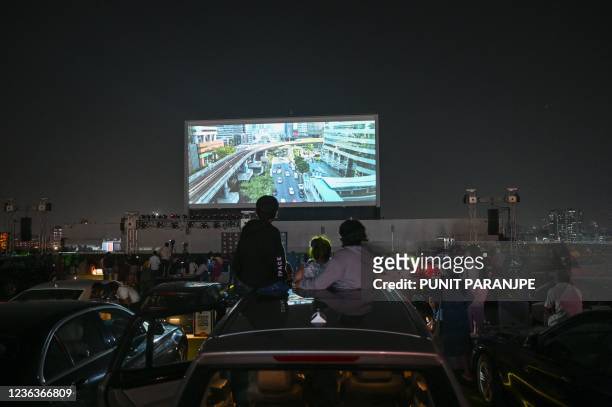 Invitees enjoy screening at the new rooftop drive-in theatre in Mumbai on November 5, 2021.