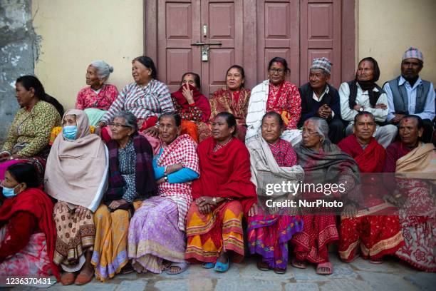 Nepalese people watch the mass Mha: Pooja ceremony at Khokana, Lalitpur on Friday, November 5, 2021. Mha: Pooja meaning worshipping own bodies in...