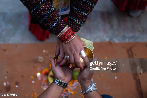 Nepalese people take part in a mass Mha: Pooja ceremony at Khokana, Lalitpur on Friday, November 5, 2021. Mha: Pooja meaning worshipping own bodies...