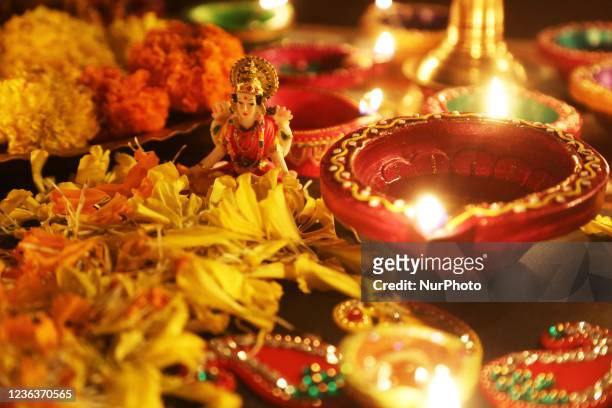 Diyas surround an idol of Goddess Lakshmi during the festival of Diwali at a Hindu temple in Toronto, Ontario, Canada, on November 04, 2021.