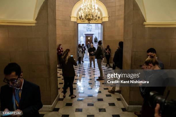 Journalists wait outside the office of Speaker of the House Nancy Pelosi on Friday, Nov. 5, 2021 in Washington, DC. After months of negotiations...