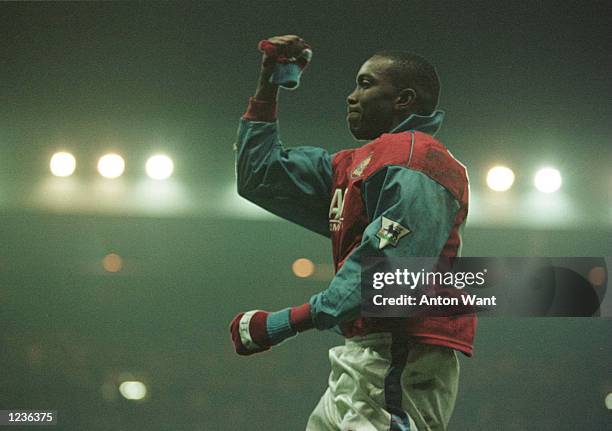 Dwight Yorke of Villa celebrates scorimg the winning goal during Aston Villa v Tottenham Hotspurs in the FA Premiership at Villa Park. Mandatory...