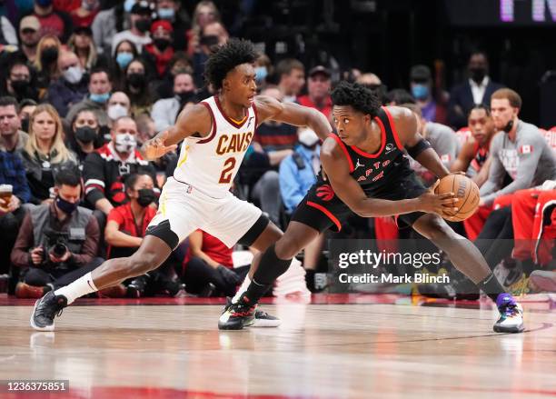 Anunoby of the Toronto Raptors is guarded by Collin Sexton of the Cleveland Cavaliers during the first half of their basketball game at the...