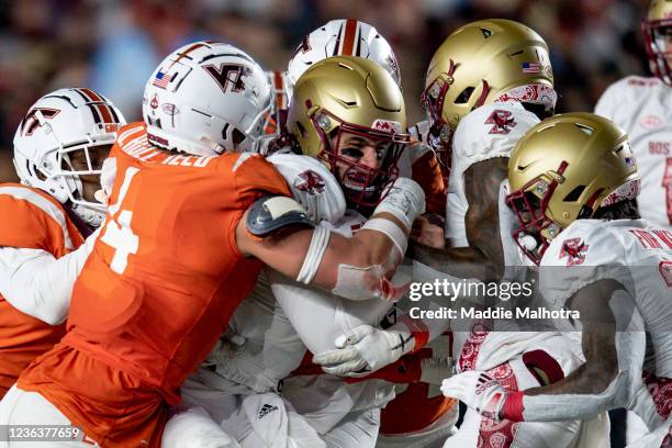 Phil Jurkovec of the Boston College Eagles is tackled as he carries the ball against the Virginia Tech Hokies at Alumni Stadium on November 05, 2021...