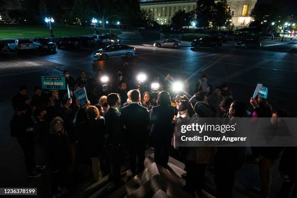 Rep. Josh Gottheimer and Rep. Pramila Jayapal speak to reporters outside the U.S. Capitol to announce a deal between Progressive House Democrats and...