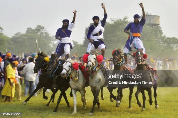 Members of the Nihang Sikh community perform martial art on the occasion of Bandi Chhor Divas, on November 5, 2021 in Amritsar, India.