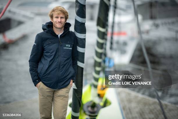 French skipper Francois Gabart poses aboard the Ultim multihull SVR - Lazartigue at the harbour of Le Havre, northern France, on November 6 a day...