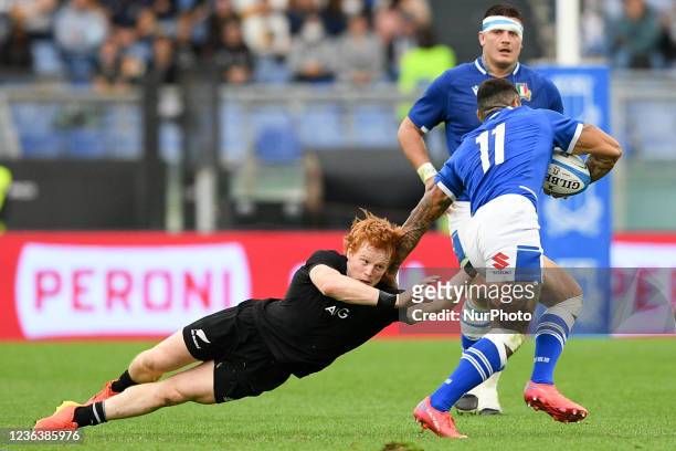 Montanna Ioane of Italy challenged by Finlay Christie of New Zealand All Blacks during the Autumn Nations Series 2021 match between Italy and New...