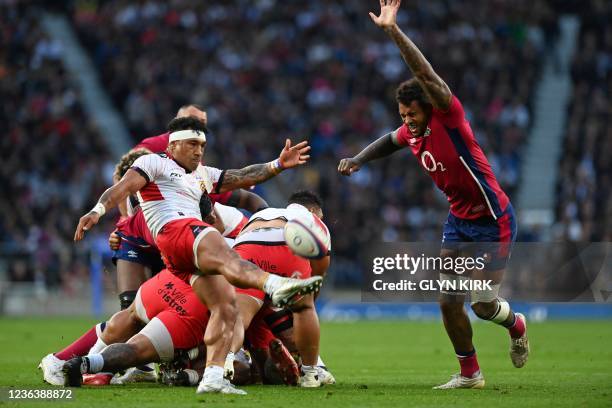 England's flanker Courtney Lawes fails to block a kick from Tonga's scrum-half Sonatane Takulua during the Autumn International friendly rugby union...