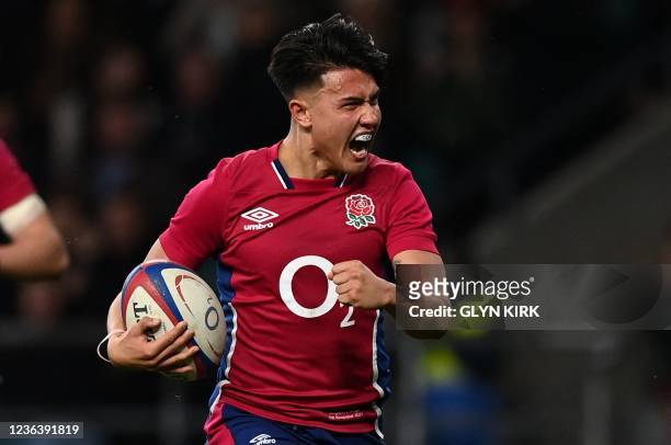 England's Marcus Smith runs to score his team's 9th try during the Autumn International friendly rugby union match between England and Tonga at...