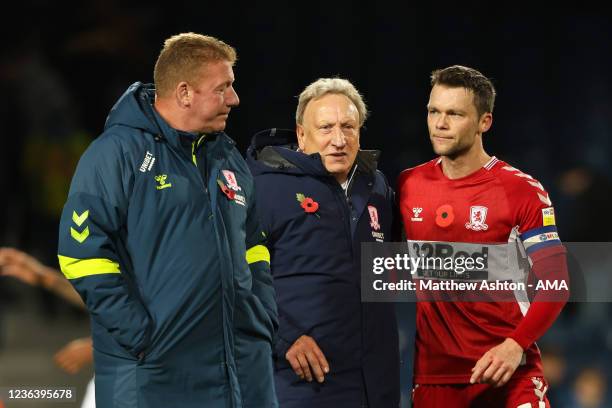 First team coach Ronnie Jepson and Neil Warnock the head coach / manager of Middlesbrough with captain Jonathan Howson of Middlesbrough during their...