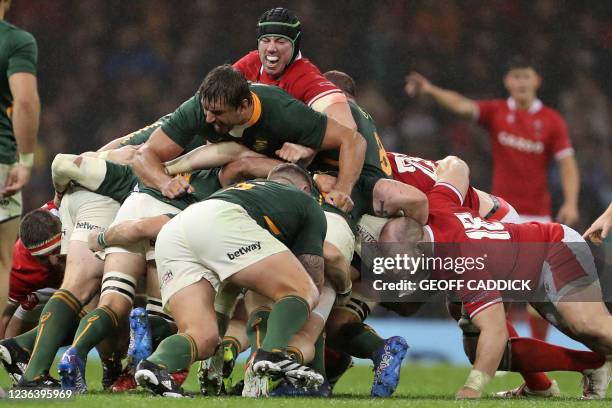 Wales' lock Adam Beard and South Africa's lock Eben Etzebeth compete in the maul during the Autumn International friendly rugby union match between...