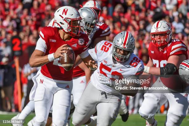 Defensive tackle Antwuan Jackson of the Ohio State Buckeyes rushes quarterback Adrian Martinez of the Nebraska Cornhuskers out of the pocket in the...