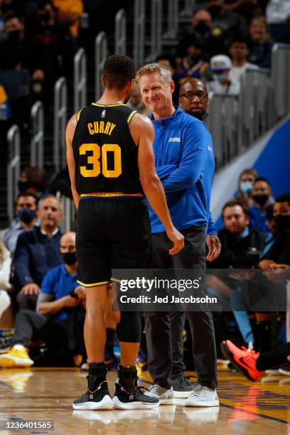 Steve Kerr talks to Stephen Curry of the Golden State Warriors during the game against the New Orleans Pelicans on November 3, 2021 at Chase Center...
