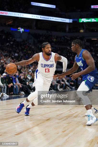 Paul George of the LA Clippers moves the ball against the Minnesota Timberwolves on November 5, 2021 at Target Center in Minneapolis, Minnesota. NOTE...