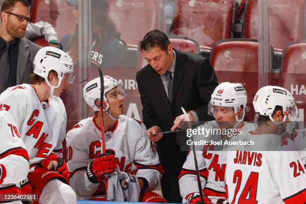 Head coach Rod Brind'Amour of the Carolina Hurricanes directs the players during a break in action against the Florida Panthers at the FLA Live Arena...