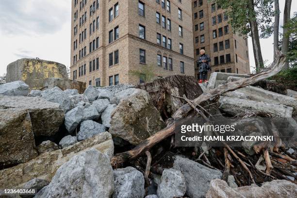 Jera Slaughter stands outside her high-rise apartment building impacted by erosion from Lake Michigan on October 14 in Chicago, Illinois. - The five...
