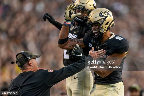 Wide receiver Daniel Arias of the Colorado Buffaloes celebrates with wide receiver Brenden Rice after a first quarter touchdown against the Oregon...