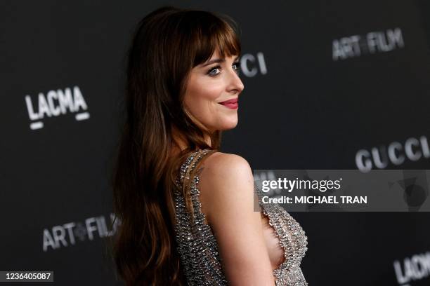 Actress Dakota Johnson arrives for the 10th annual LACMA Art+Film gala at the Los Angeles County Museum of Art in Los Angeles, California on November...