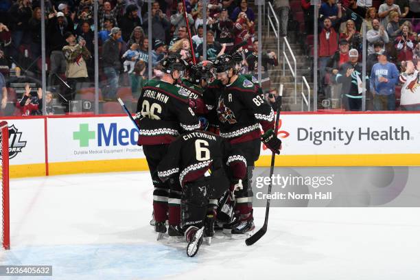 Jakob Chychrun, Anton Stralman, Jay Beagle, Shayne Gostisbehere, Lawson Crouse and Scott Wedgewood of the Arizona Coyotes celebrate after beating the...