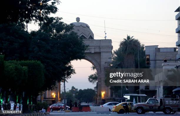 Picture taken on November 7, 2021 shows cars parked outside the main entrance of the Green Zone near the ministry of defence and planning in the...