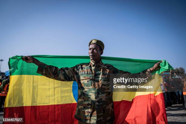 War veteran carries Ethiopias national flag as a ceremony is held to support the Ethiopian military troops who is battling against the Tigrays People...
