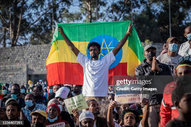 Man holds Ethiopian national flag as a ceremony is held to support the Ethiopian military troops who is battling against the Tigrays People...