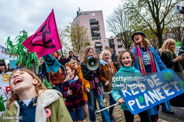 Group of children is shouting slogans against climate change, during a massive Climate march organized in Amsterdam, on November 6th, 2021.